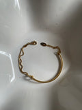 Amani · Double chain bracelet with filigree knot · 18k gold plated